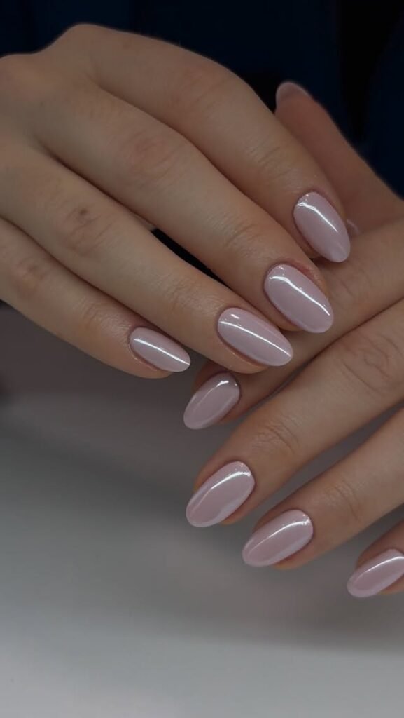 Nude pink French diamond manicure